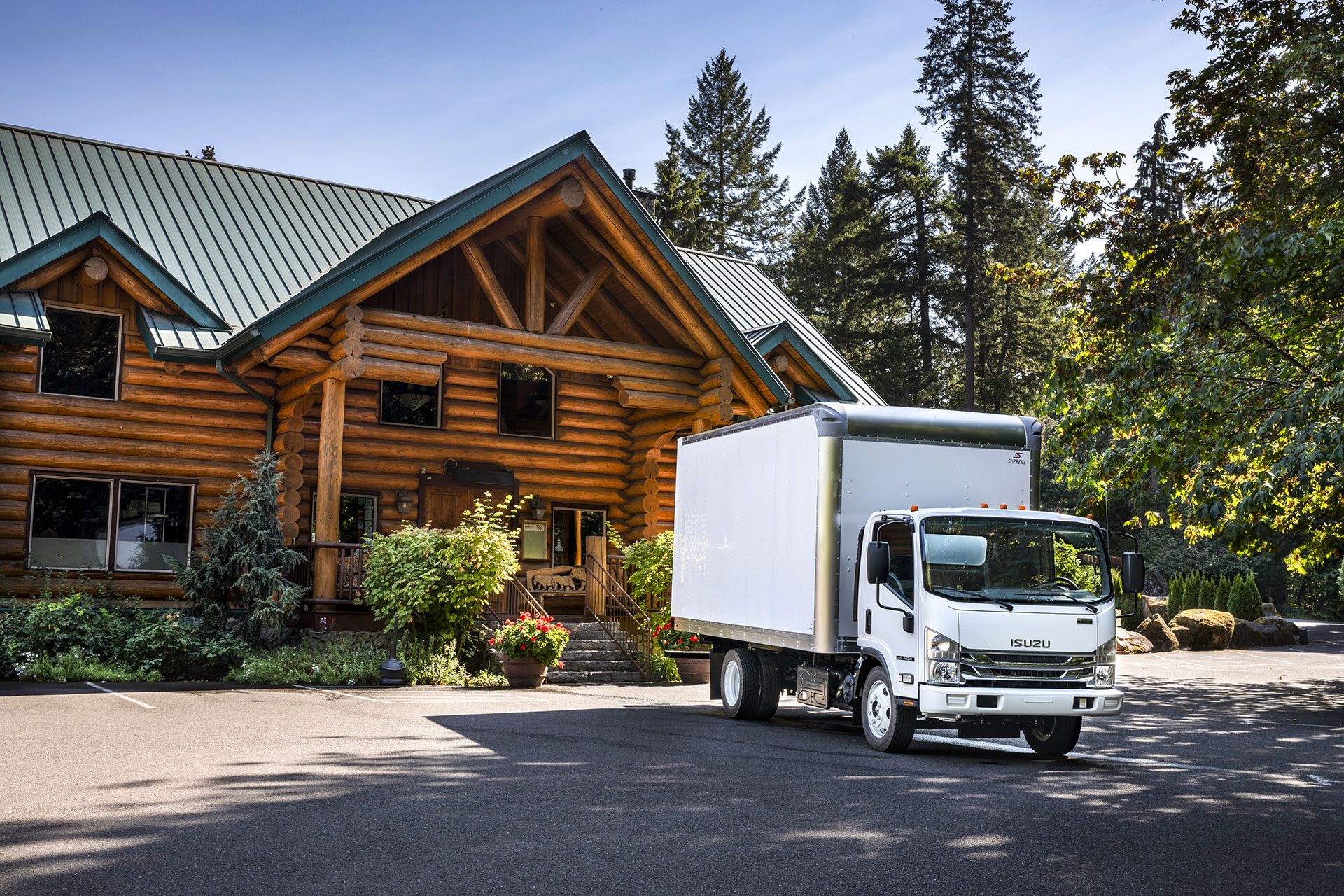 Isuzu truck outside of a lodge.