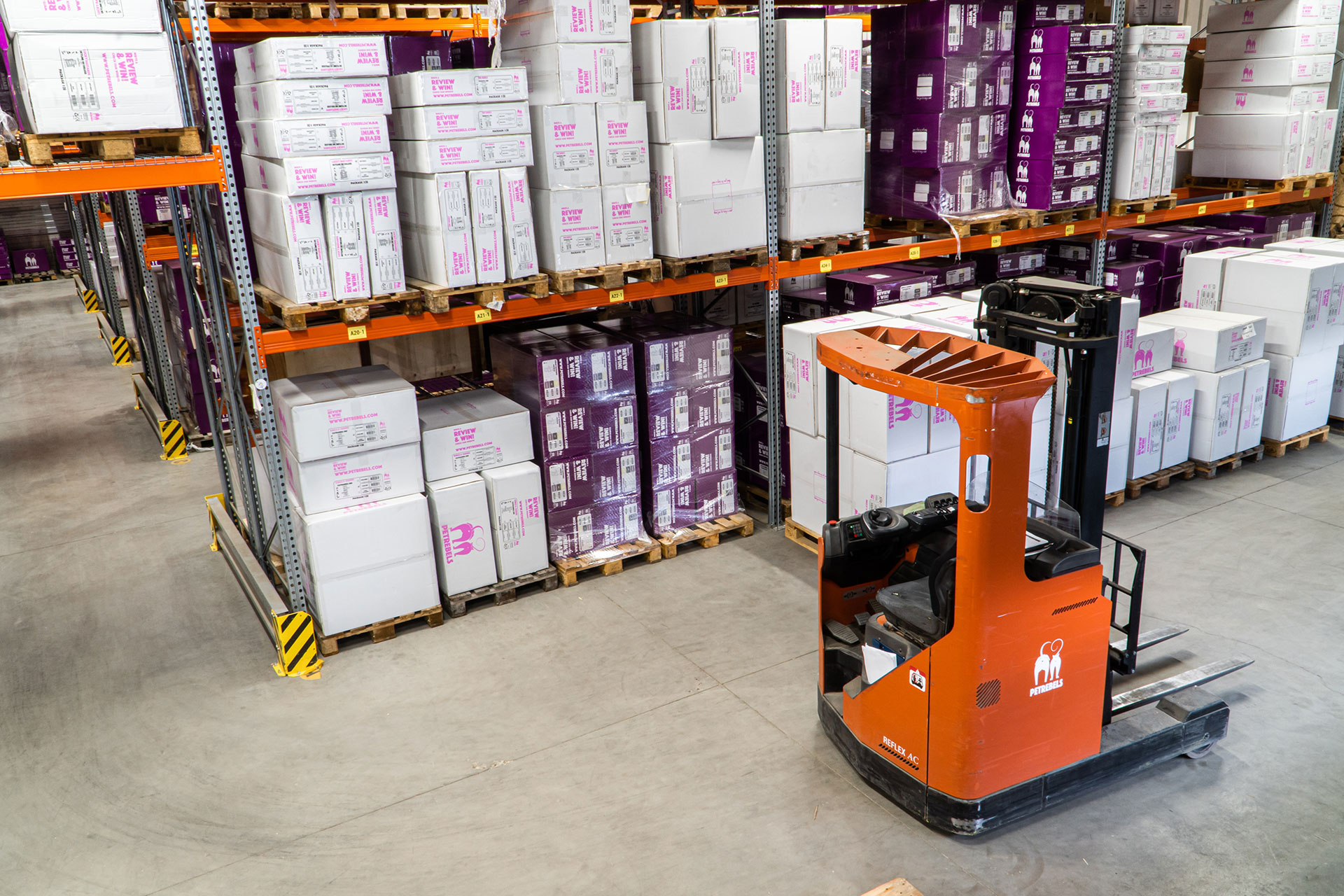Forklift in a warehouse getting ready to load delivery trucks.