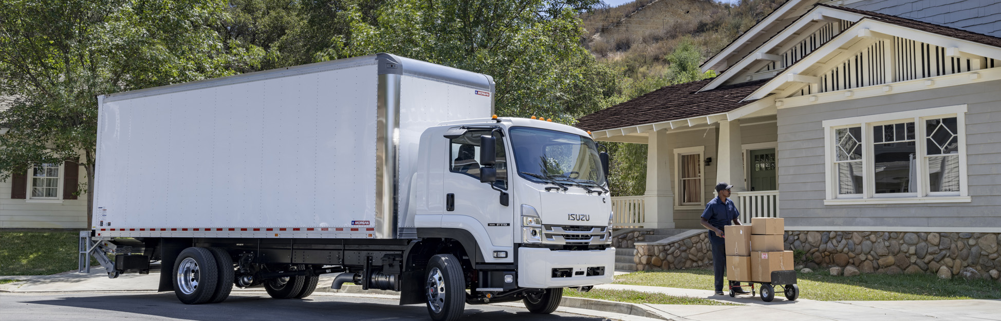 Residential delivery being made using an Isuzu truck.