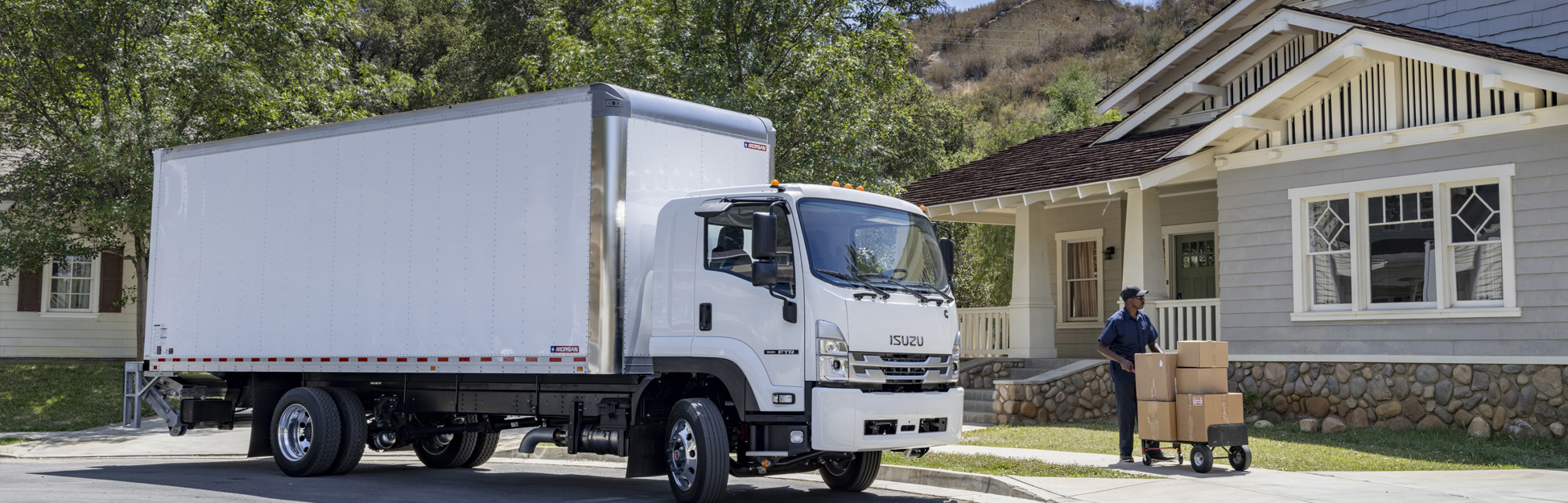 Residential delivery being made using an Isuzu truck.
